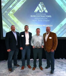 Manhattan team members accept award for Globe Life Field