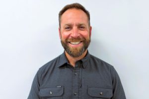 David Burns wearing a slate-colored work shirt.