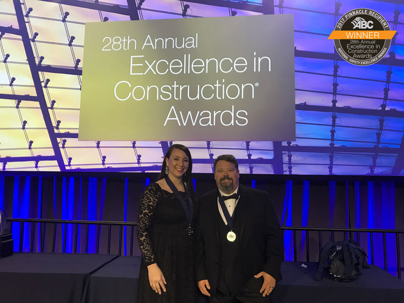 Caption: On behalf of Manhattan Construction Company, Safety Managers Trista Shomo and Scott Marsh accepted the National Safety Pinnacle Award from the Associated Builders and Contractors (ABC) on March 21 during the 28th annual Excellence in Construction® Awards at ABC Convention 2018 in Long Beach, Calif.