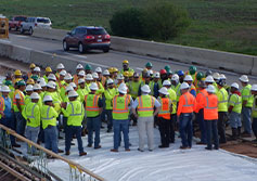 Manhattan Road & Bridge Team members meet at Kilpatrick Turnpike job